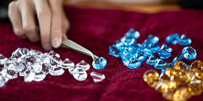 close-up-cropped-hand-holding-gemstone
